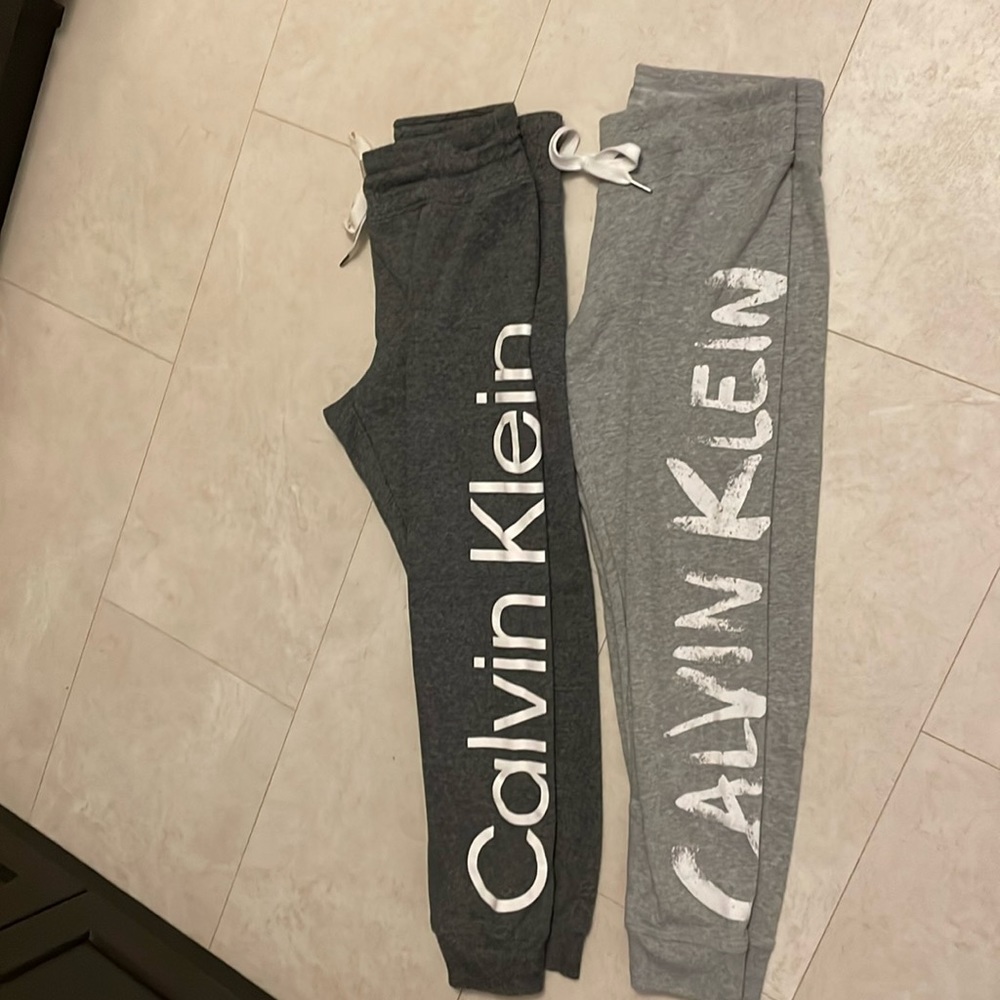 Calvin Klein sweater and two track pants